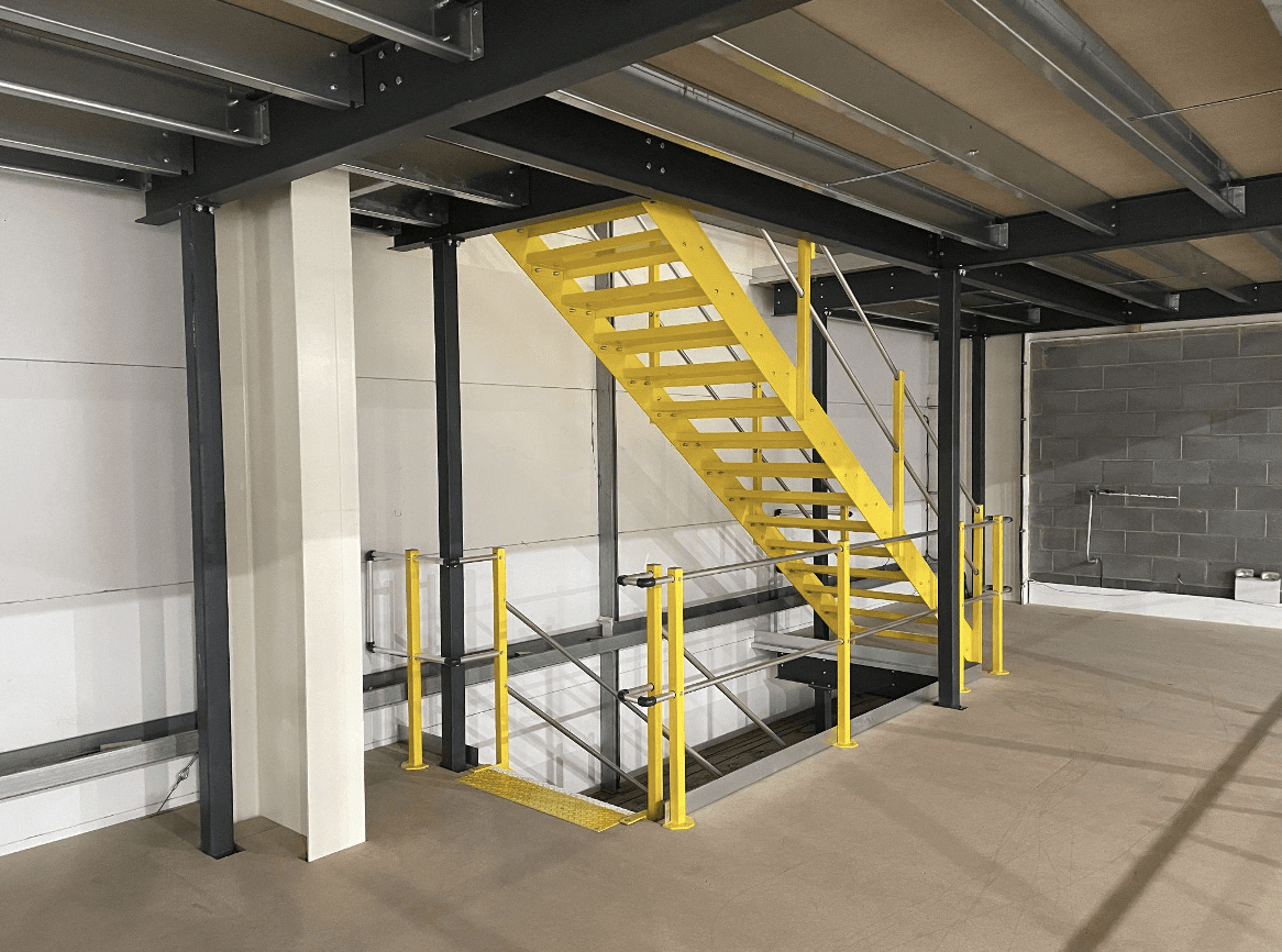 Yellow stairs connecting mezzanine floors.