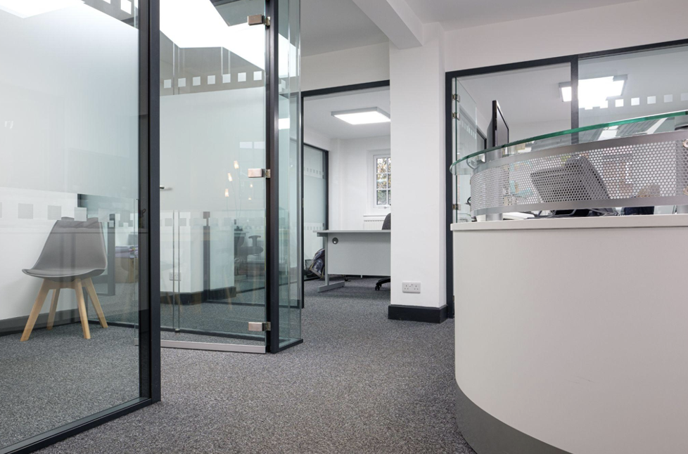Commercial partition walls | Glass partitions in modern office reception.