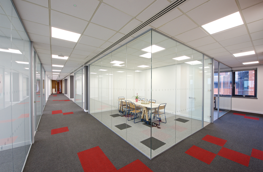 Frameless glass office partitions | Glass office partitions in sleek modern office.