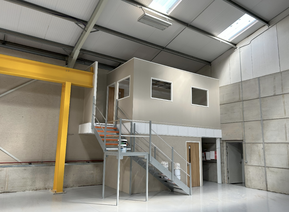 What is a mezzanine floor | Office mezzanine floor in a warehouse space.