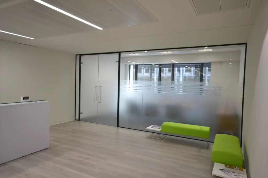 Glass wall partitions in reception space.