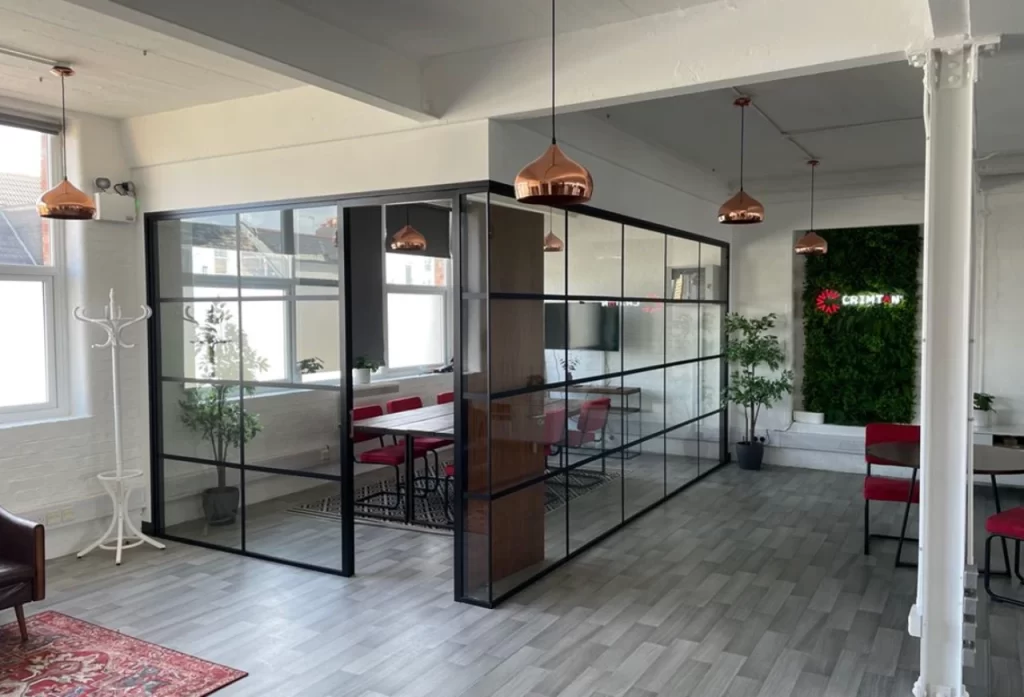 Glass wall partitions in a modern office space.