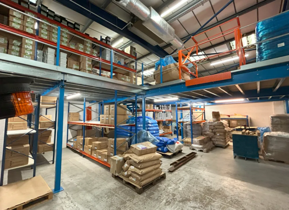 Warehouse Mezzanine Flooring | Mezzanine floor in an office space with pallet gate.