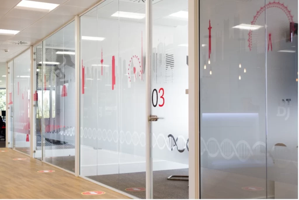Glass wall partitions in modern office space.