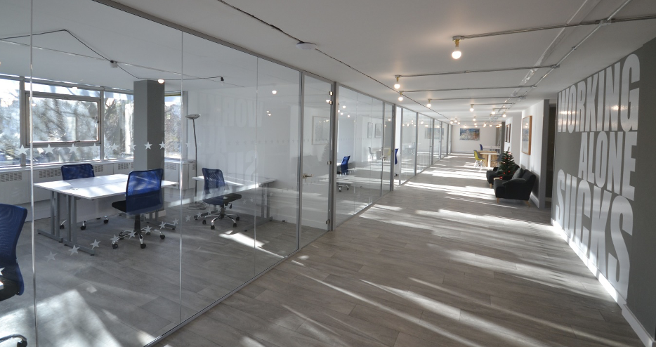 Frameless Glass Partition | Office corridor with glass partitions.
