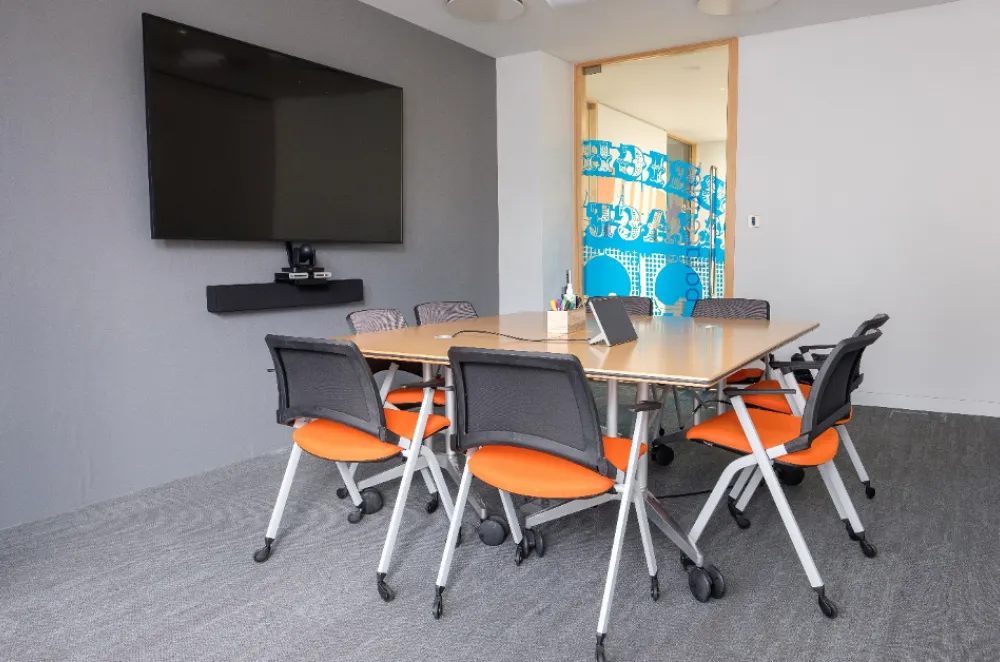 Boardrooms | Meeting room with modern furniture and table.