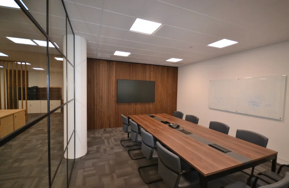 Boardrooms | Boardroom with wooden table and acoustic treatment.
