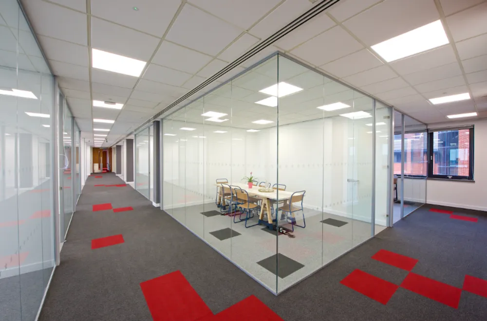 Office interior design | Modern office space with glass meeting rooms.